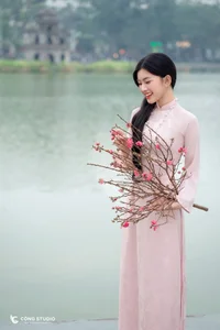 Graceful Muse in Traditional Pink Ao Dai - image 8