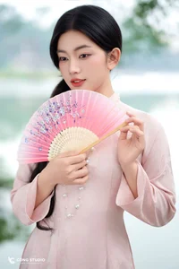 Graceful Muse in Traditional Pink Ao Dai - image 0